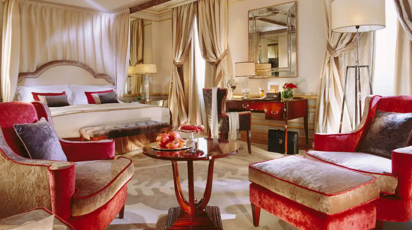 Luxury bedroom at Hotel Principe di Savoia in Milan, featuring elegant decor and furnishings.