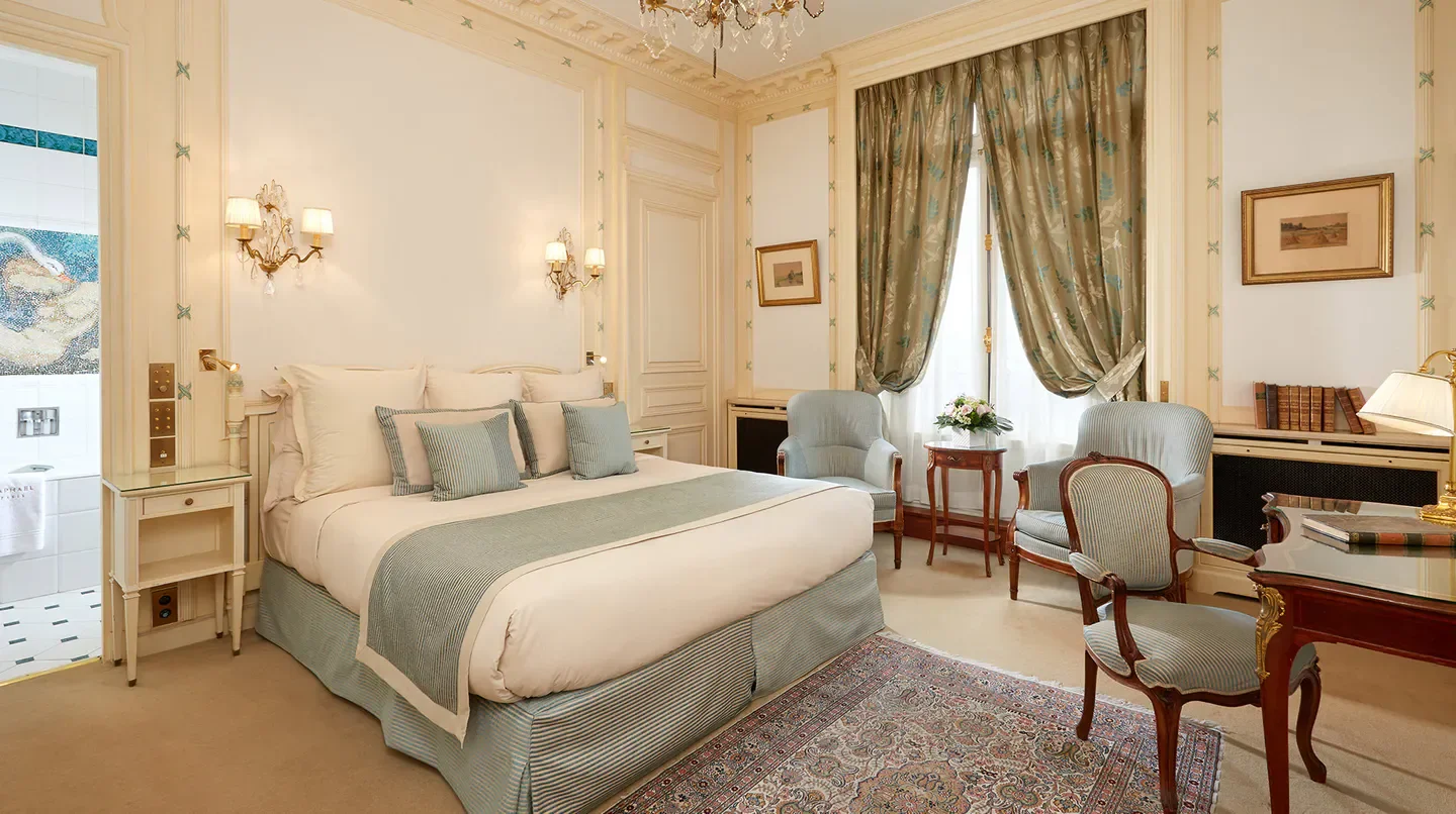 Elegant bedroom at Hotel Raphael Paris, showcasing Parisian style and luxury in Paris.