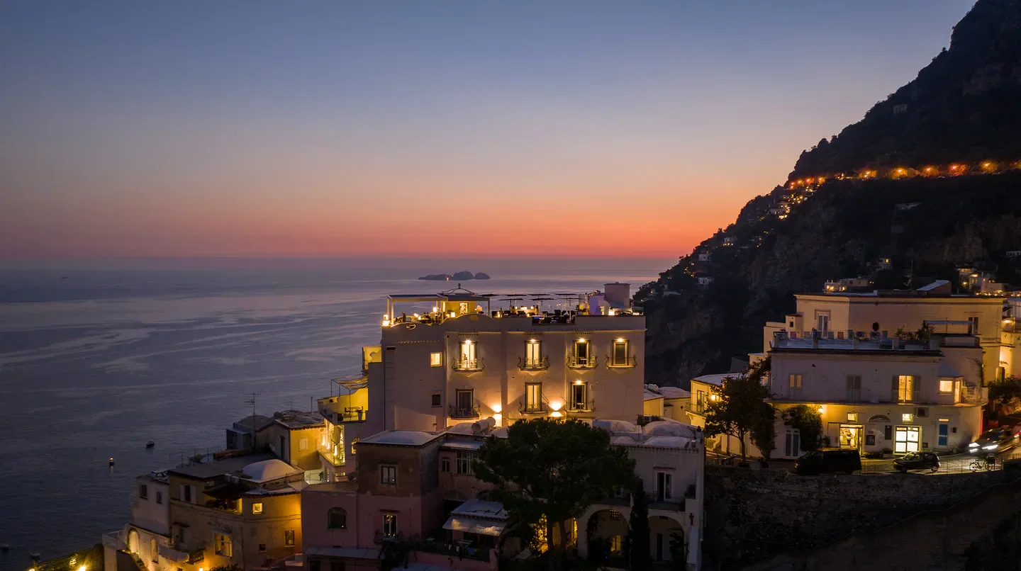 Hotel Villa Franca in Venice, at sunset with scenic ocean views and lights.