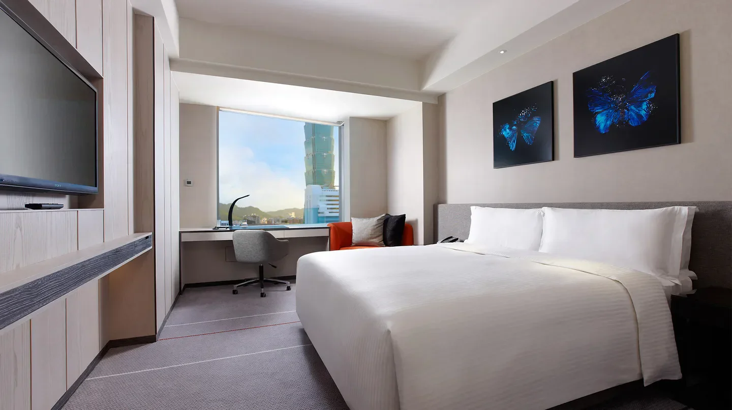 Modern hotel room at Humble House Taipei with Taipei 101 view and butterfly art