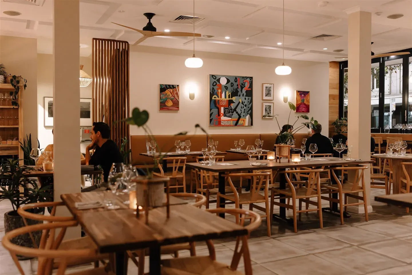 Elegant dining at HUMBUG restaurant in Newcastle, featuring stylish decor and warm lighting.