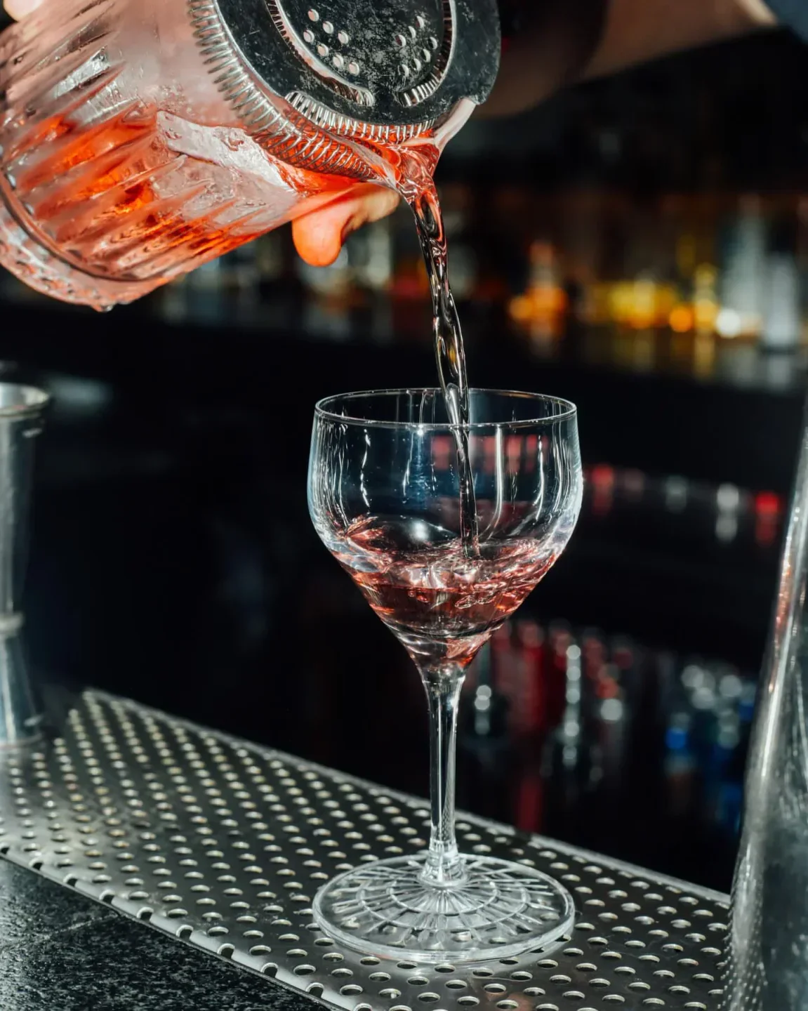 Cocktail being poured at Huset restaurant in Mexico City, a stylish dining experience.