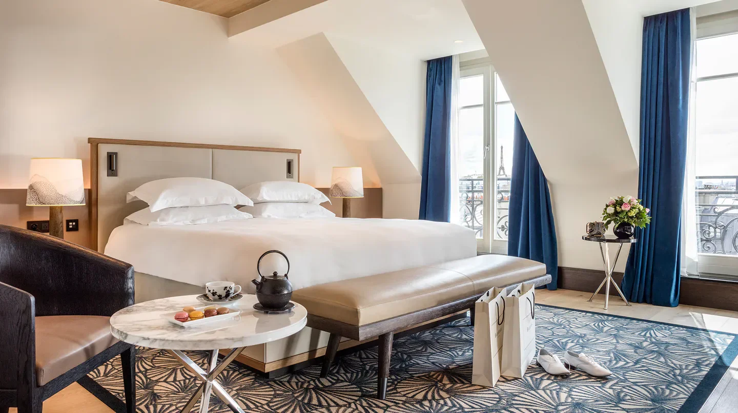 Cozy bedroom at Hyatt Paris Madeleine with Eiffel Tower views, Paris, France.