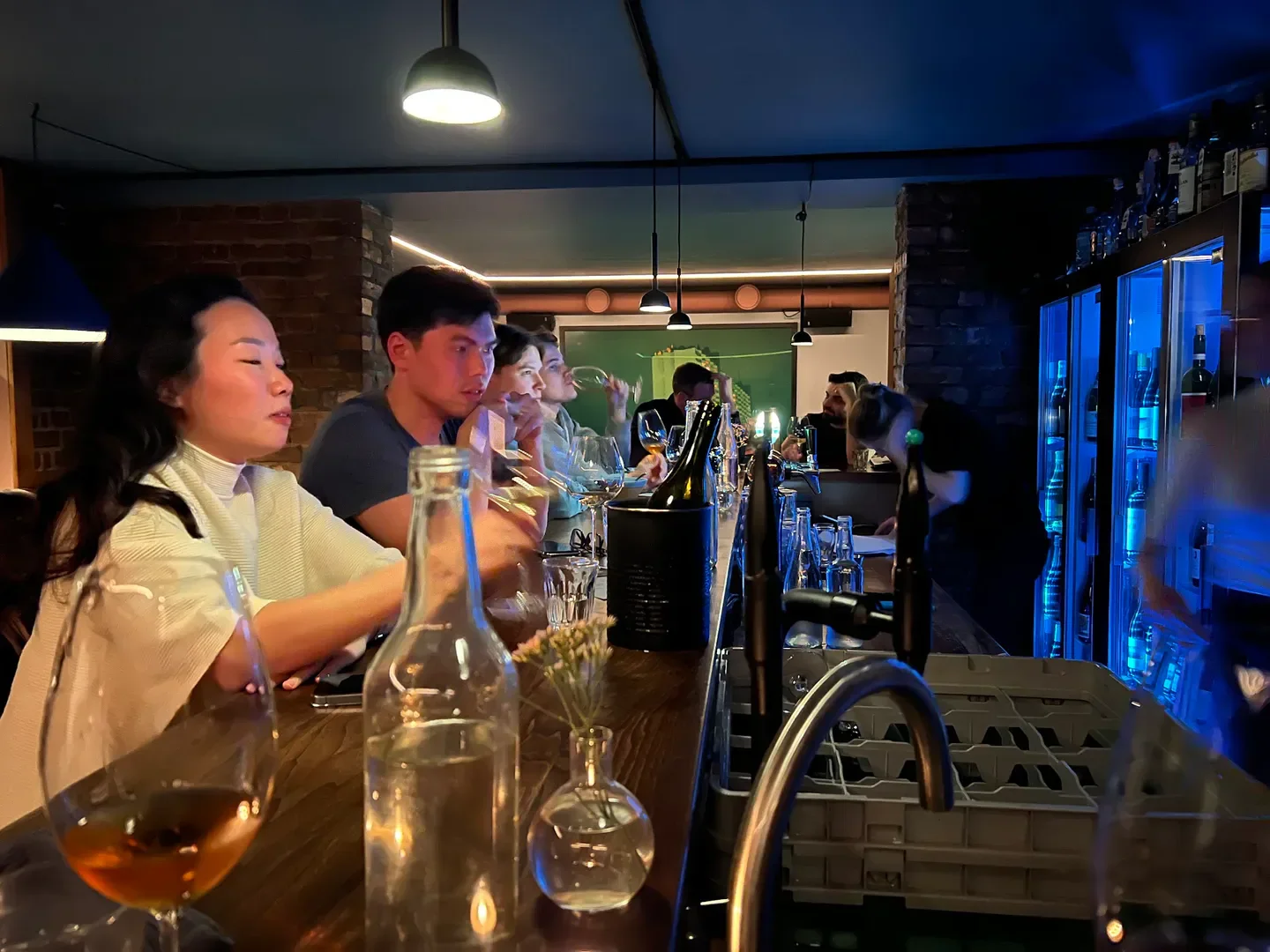 Patrons enjoying drinks at the bar inside Hyde restaurant in Oslo, Norway.