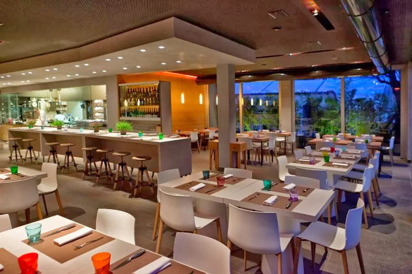 Modern interior of I Tigli – San Bonifacio restaurant in Verona, Italy, with tables set for dining.