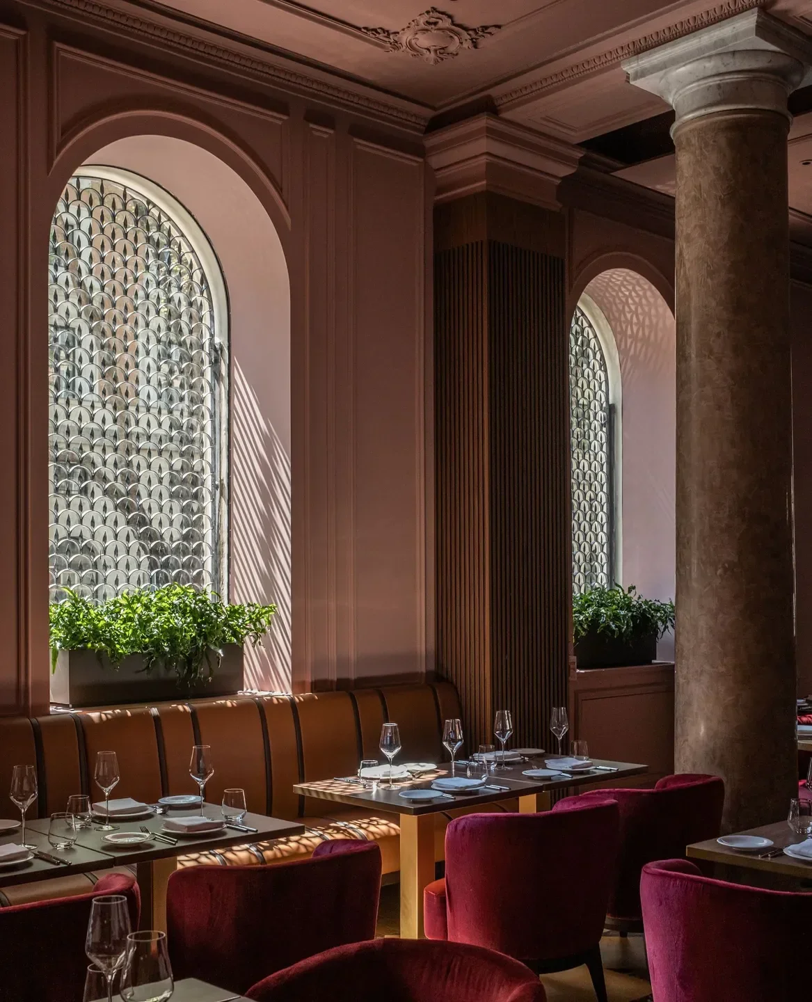 Elegant dining area at Il Becco restaurant in Mexico City with tables set.