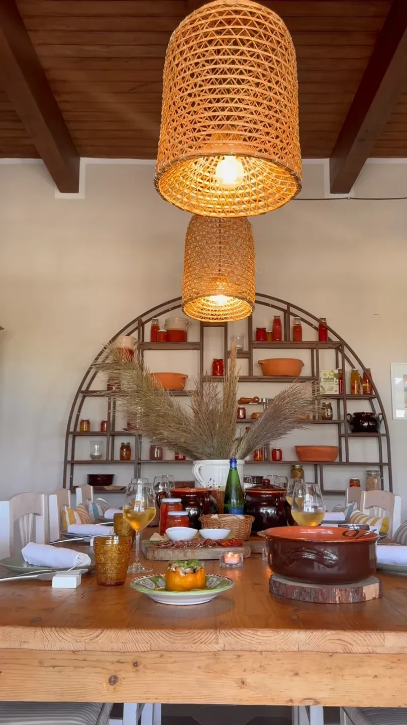 Cozy dining setup at Il Mirto restaurant in Campania, featuring warm lighting and Italian cuisine.