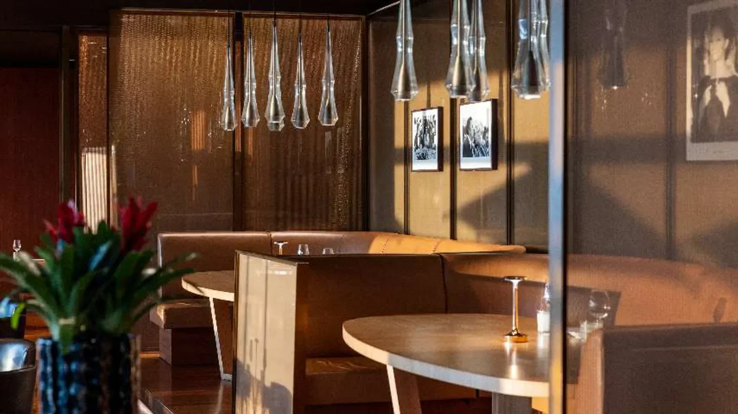 Interior of Il Ristorante Niko Romito in Dubai, featuring elegant design and lighting.