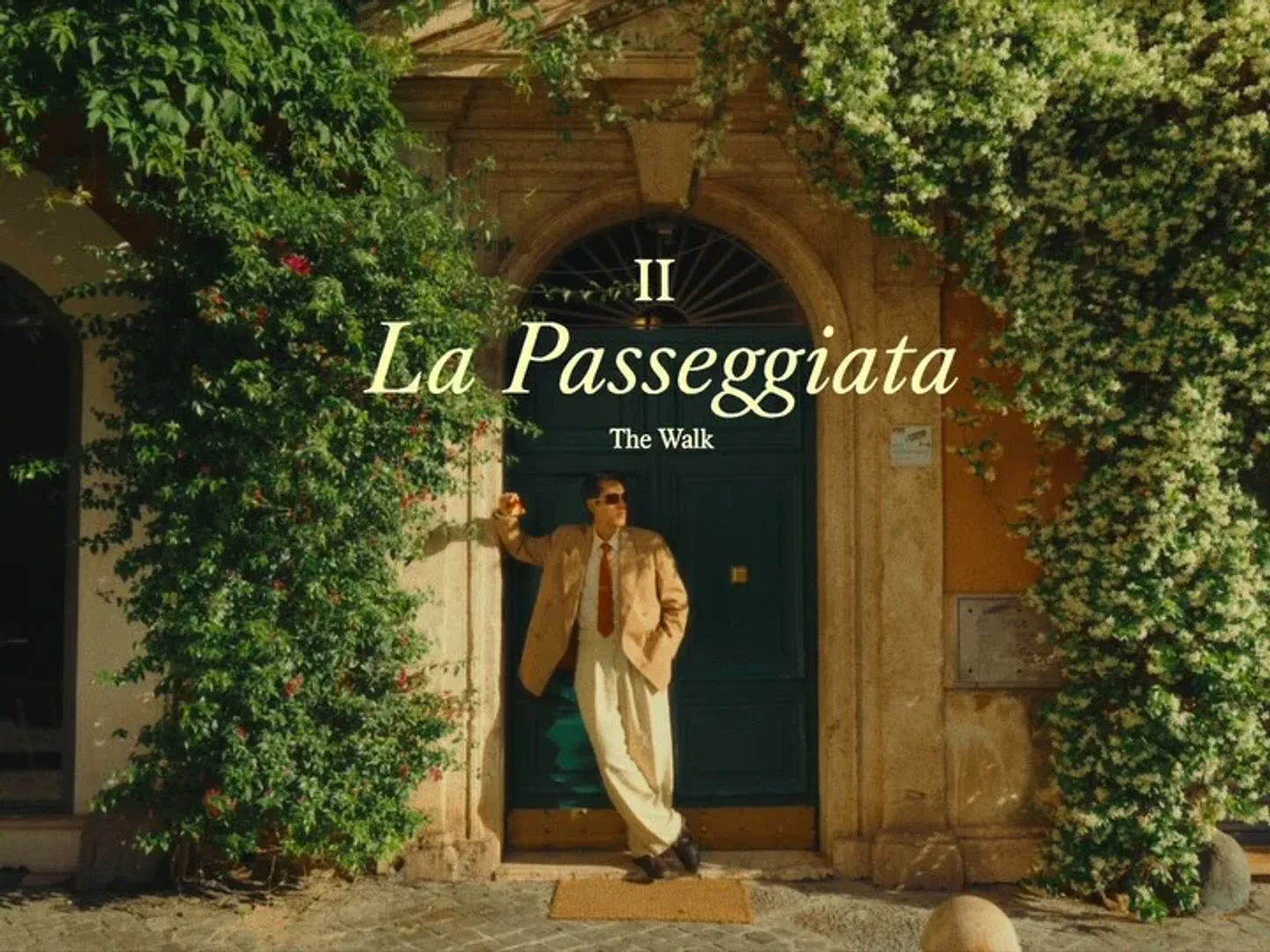 Il Ristorante - Niko Romito restaurant entrance with lush green foliage in the city