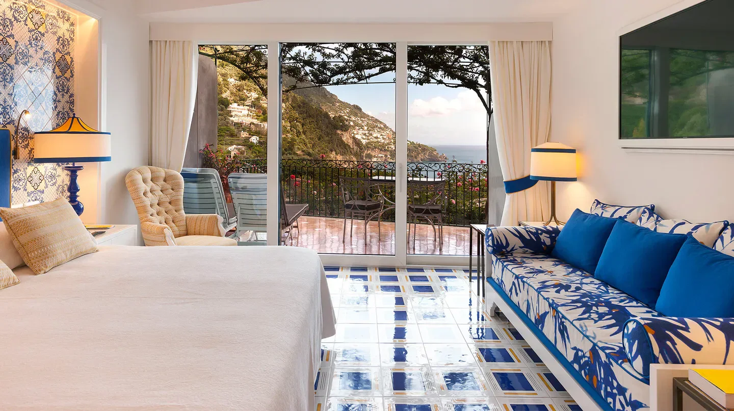 Elegant hotel room at Il San Pietro di Positano, Rome, overlooking the Amalfi Coast.