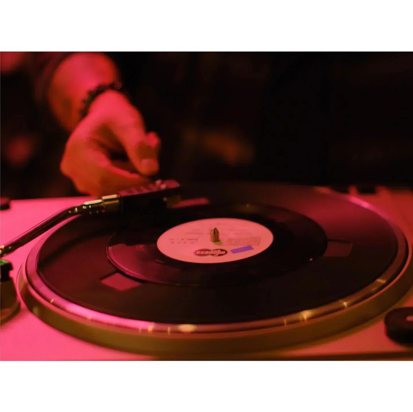 DJ spinning vinyl at Imilla Alzada restaurant in La Paz, Bolivia