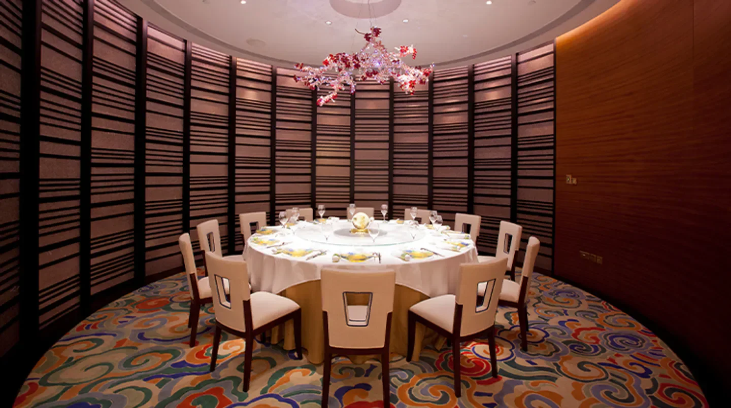 Elegant dining room at Imperial Court at MGM MACAU in Macau, with flower chandelier.