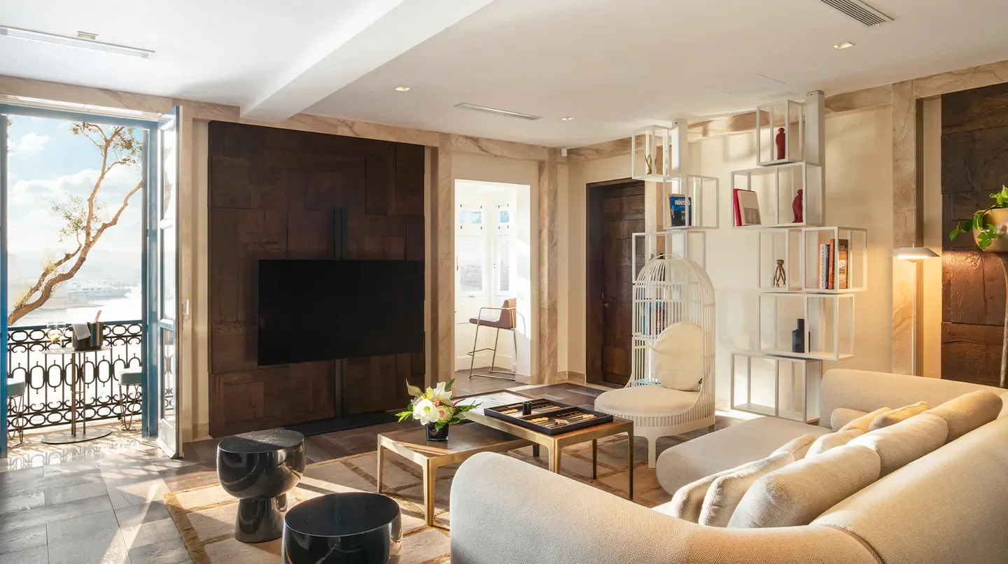 Stylish interior at Iniala Harbour House in Malta, featuring balcony views and modern design.