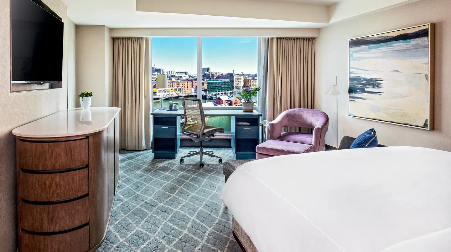 Stylish room at InterContinental Boston hotel, overlooking the Boston cityscape with desk