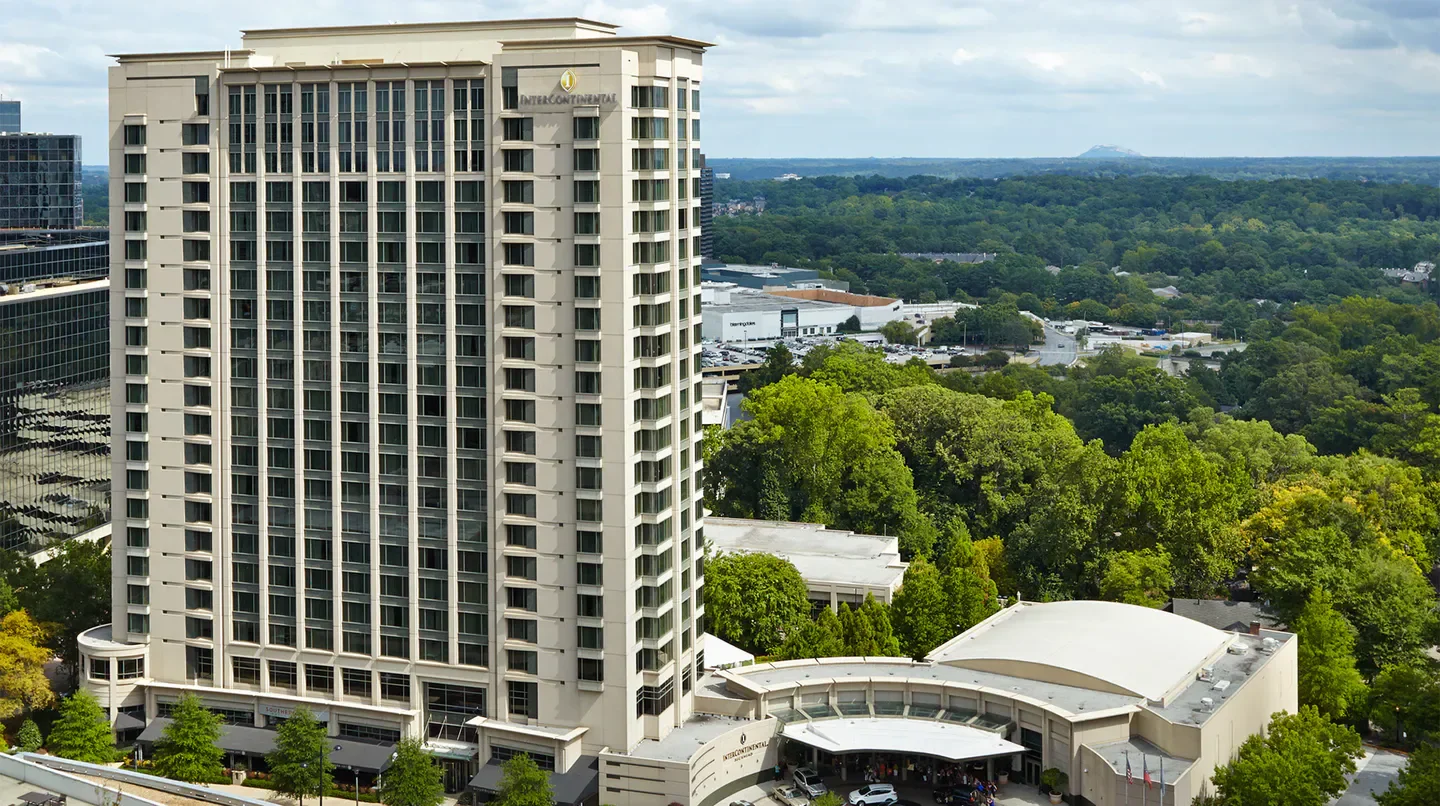 Exterior view of InterContinental Buckhead Atlanta hotel, showcasing the Atlanta skyline.