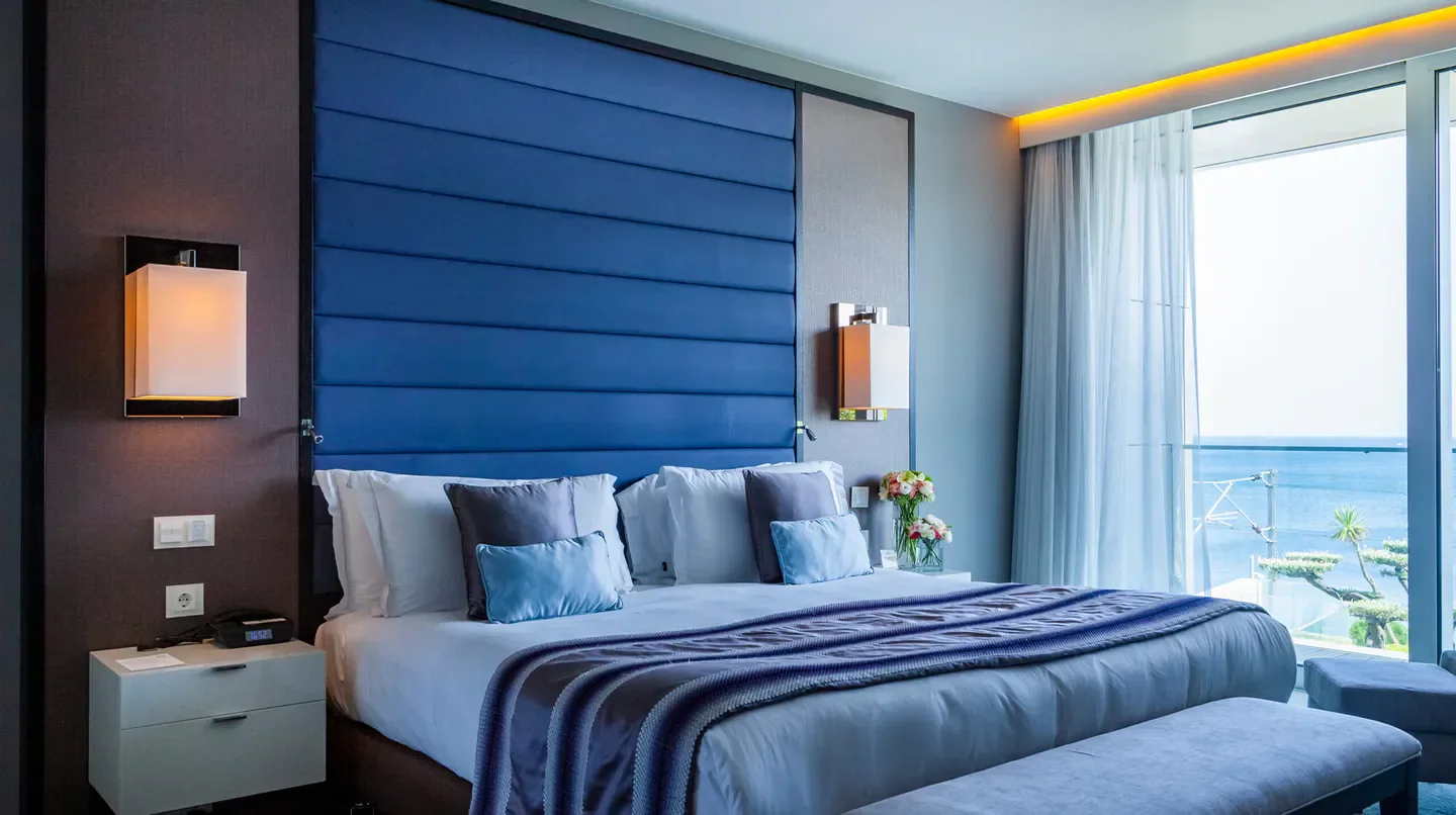 Cozy bedroom in the InterContinental Cascais-Estoril, Lisbon, overlooking the sea.