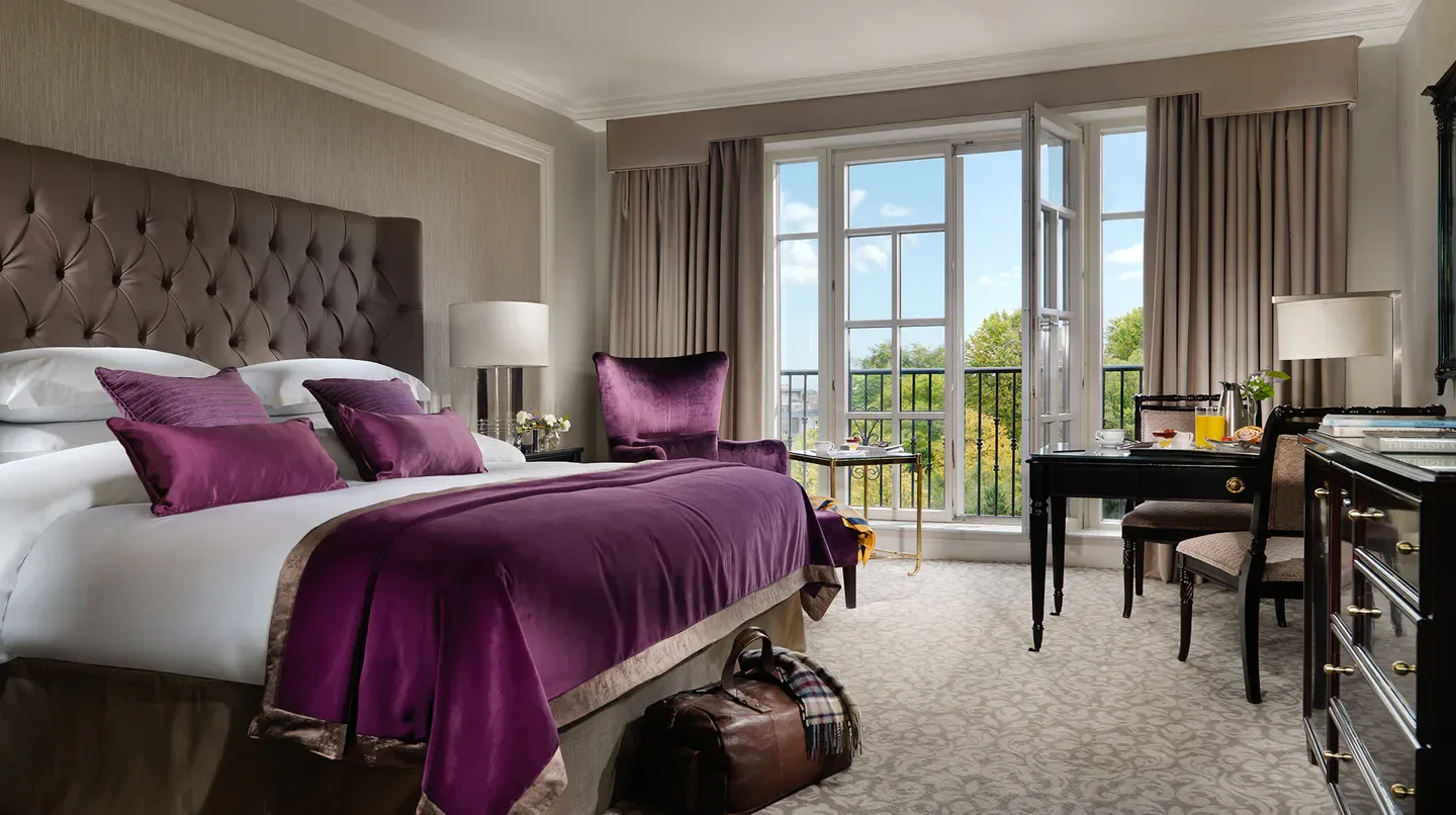 Elegant bedroom at the InterContinental Dublin hotel, with a view of Dublin's scenery.