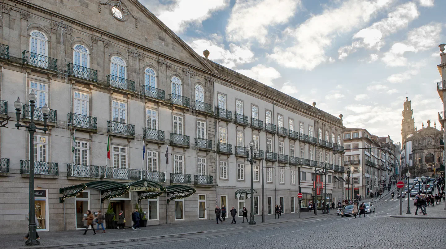 Exterior of InterContinental Porto Palacio das Cardosas hotel on a street in Porto.