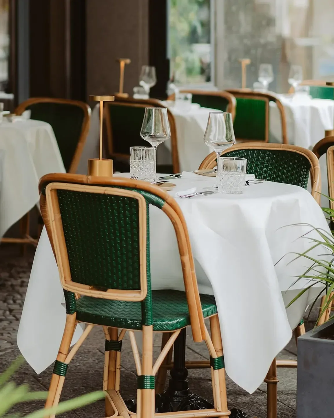 Outdoor seating at Irma la Douce in Berlin, with elegant table setting.