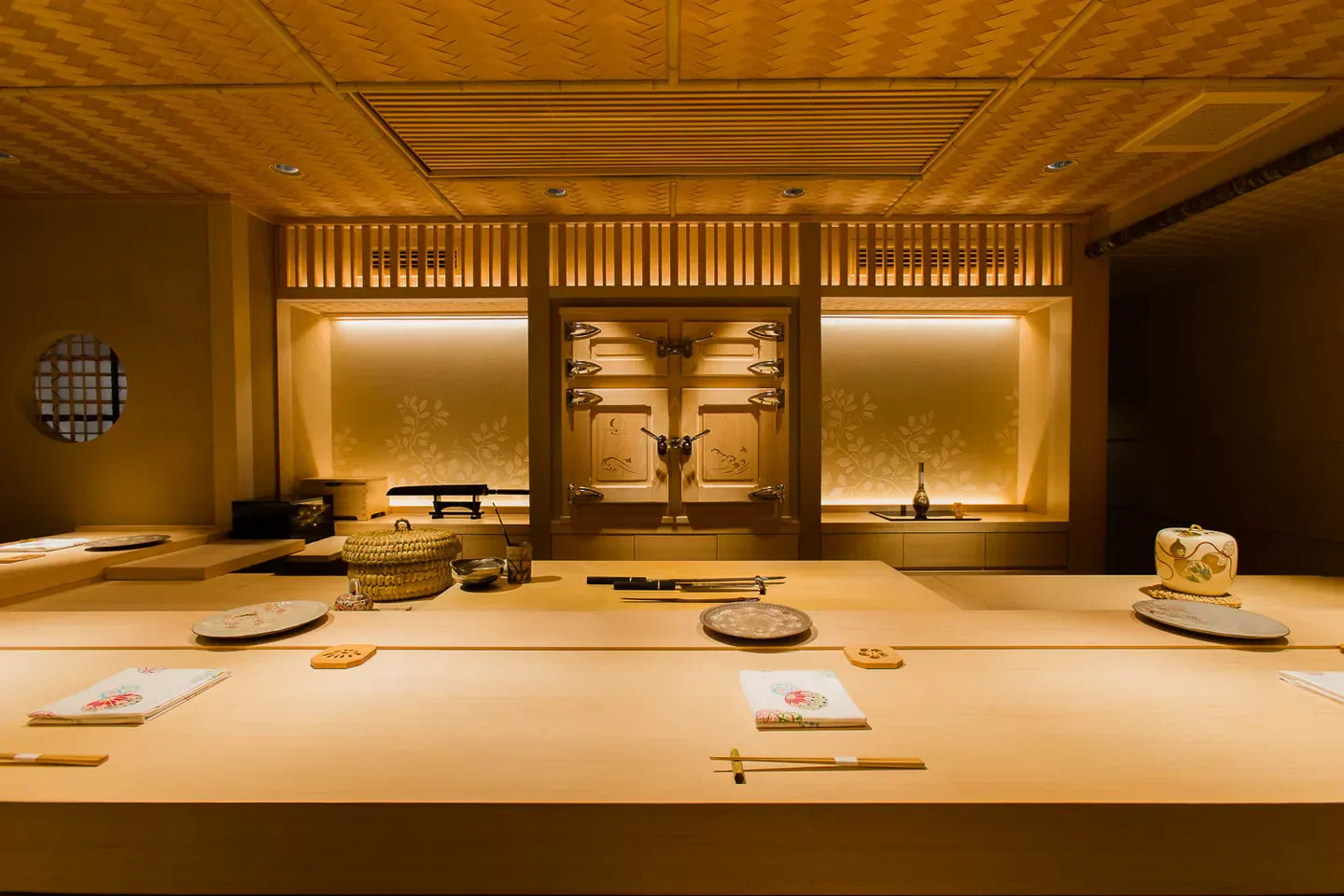 Interior of Ishibashi restaurant in Tokyo, featuring a minimalist design and dining setup.