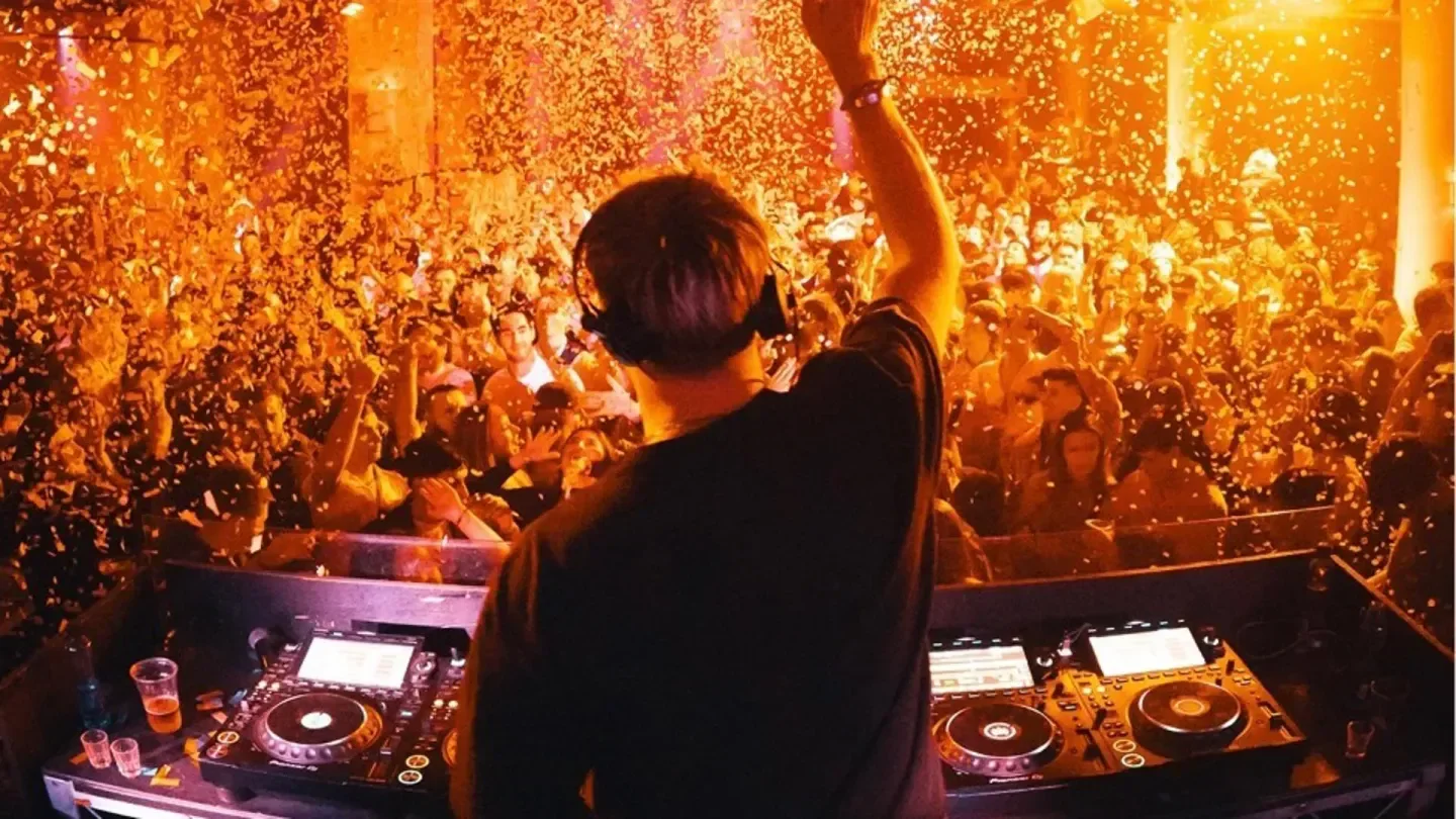 DJ at Ivy Pool in Sydney, crowd partying with confetti and energetic music