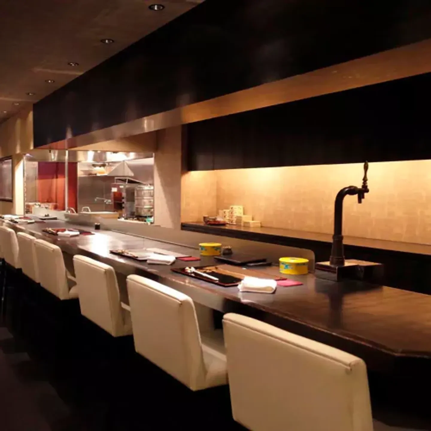 Elegant dining at Iwaki restaurant in Osaka: sleek interior and intimate seating.