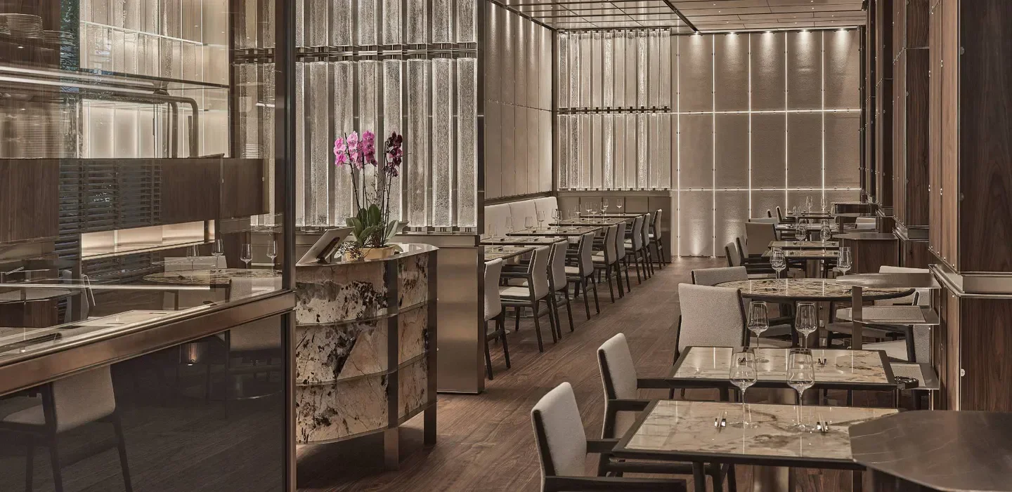 Elegant interior of IYO restaurant in Milan with stylish tables and decor
