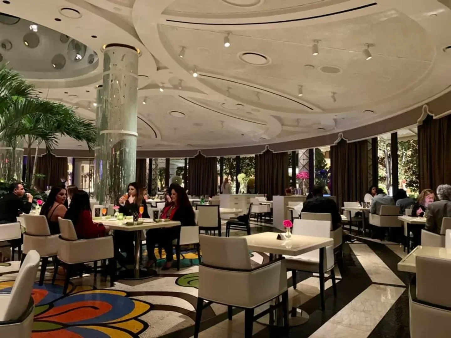 Elegant interior of Jardin in Las Vegas, featuring tables, diners, and a decorative ceiling.