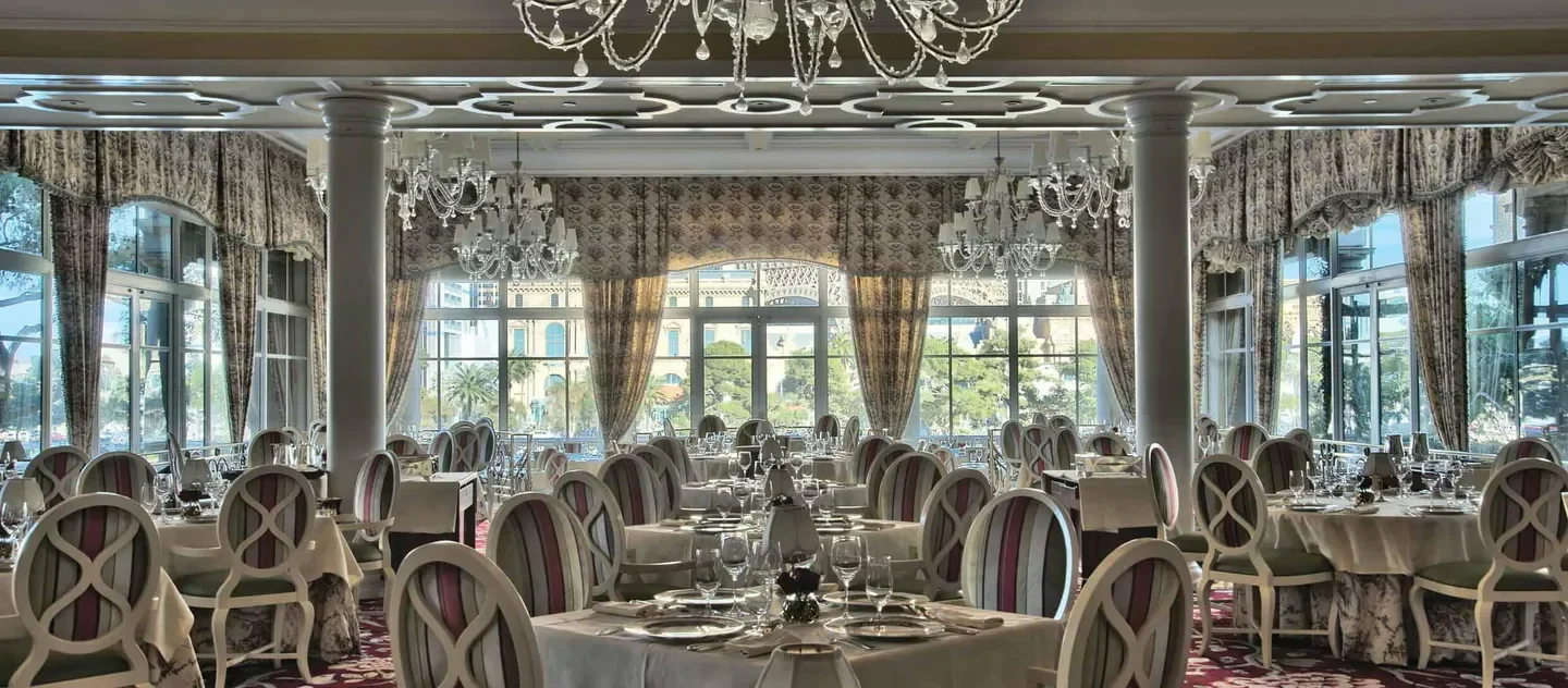 Elegant dining room at Jasmine in Las Vegas, featuring chandeliers and tables