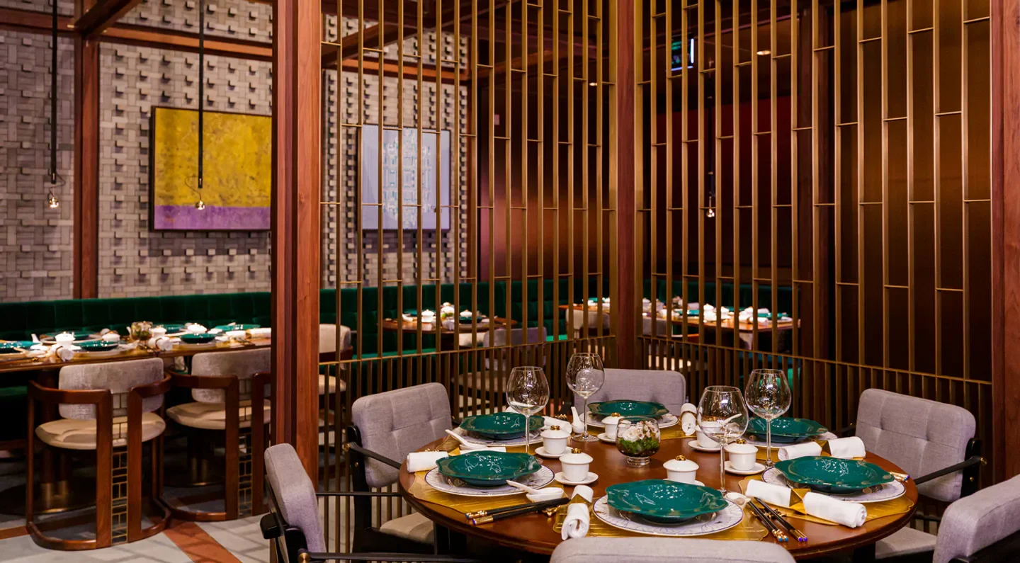 Elegant dining interior at Jiang Nan by Jereme Leung, Macau restaurant with a round table setting