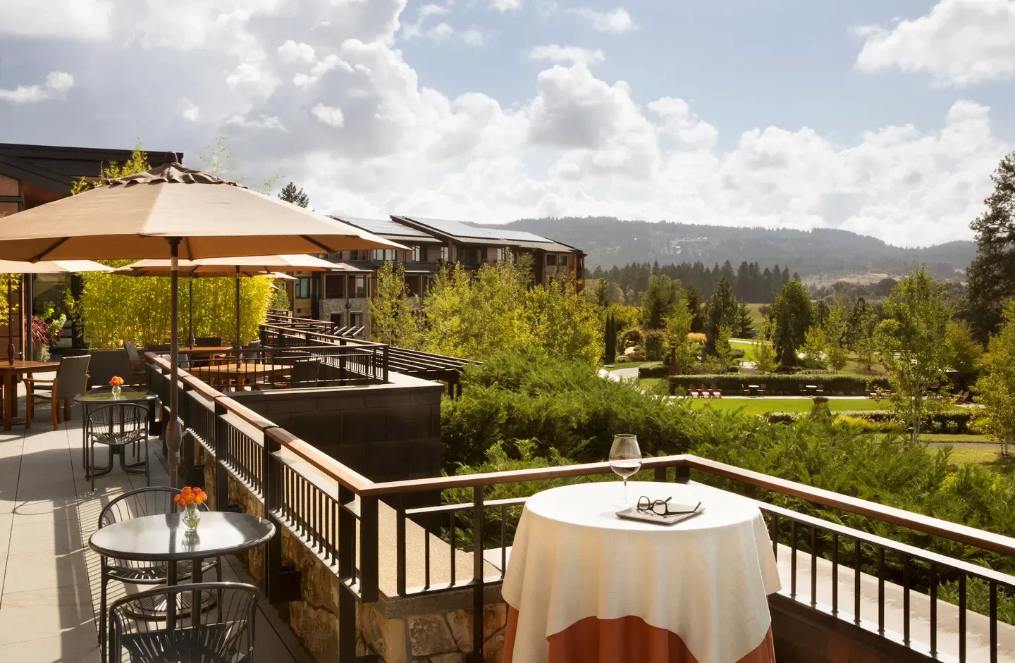 Outdoor patio with wine glass at JORY at The Allison Inn in Willamette Valley