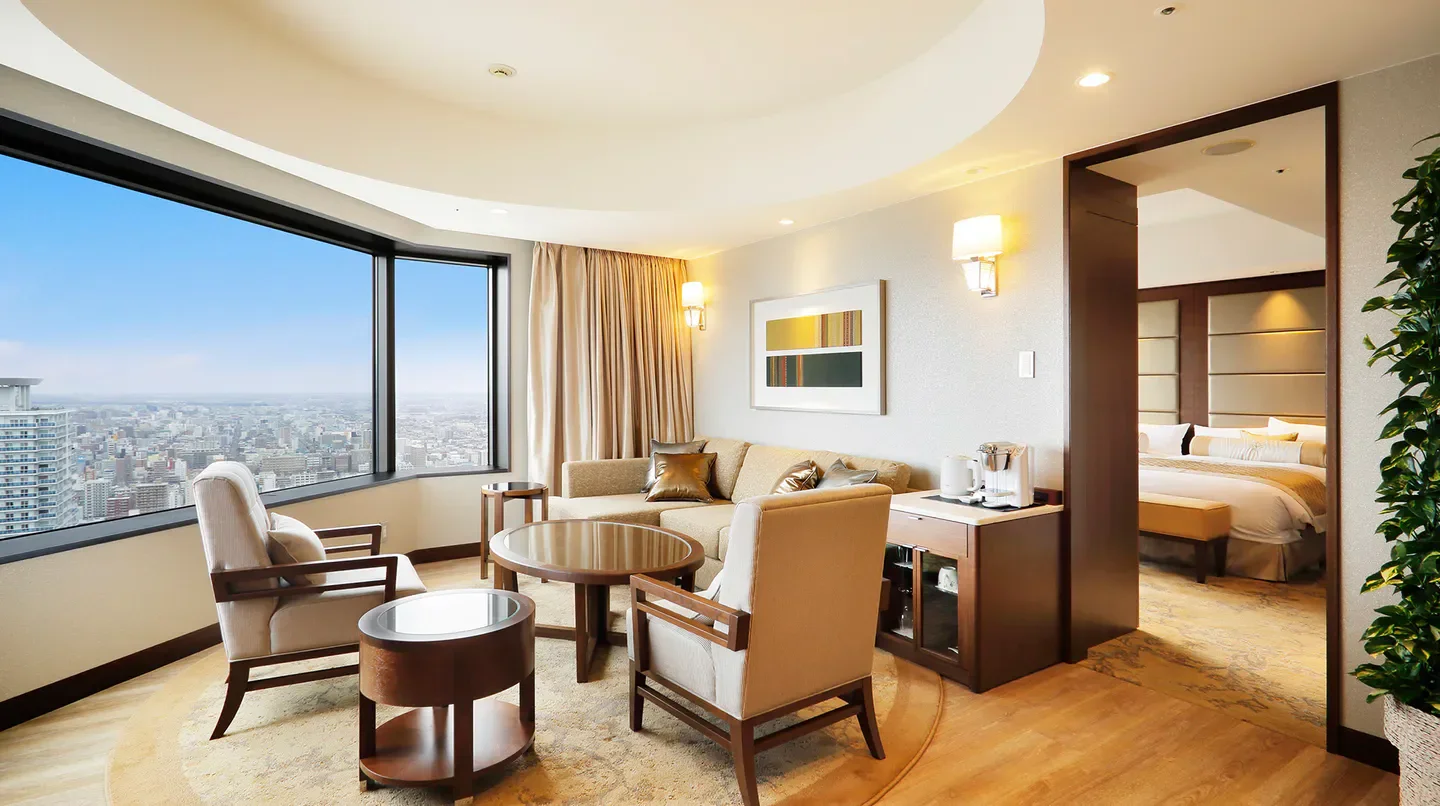 Elegant hotel suite at JR Tower Hotel Nikko Sapporo, offering scenic views of Hokkaido.