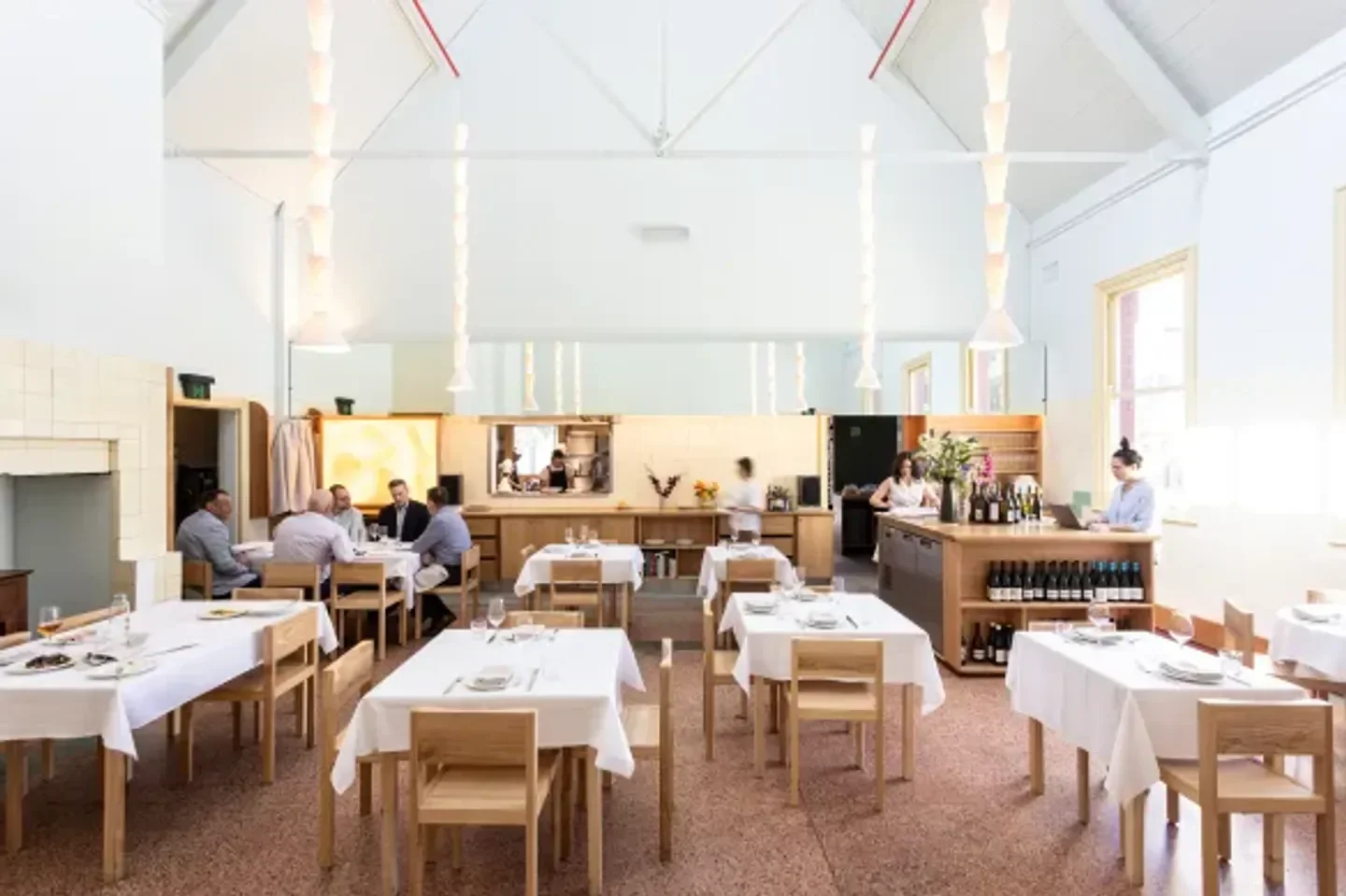 Elegant dining at Julie restaurant in Melbourne, with tables set and ready for service.