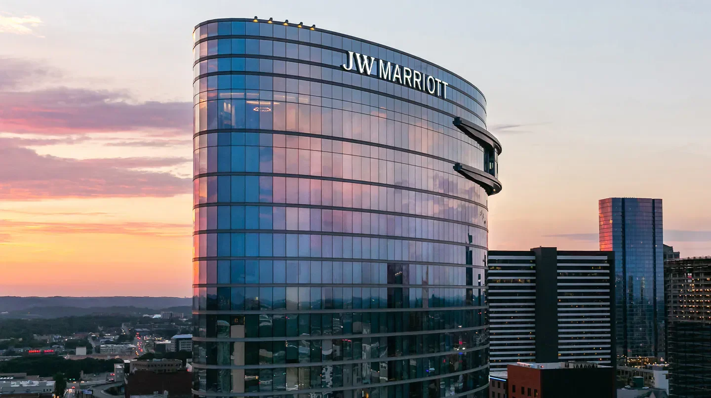JW Marriott Nashville at sunset, reflecting colorful skies over the city.
