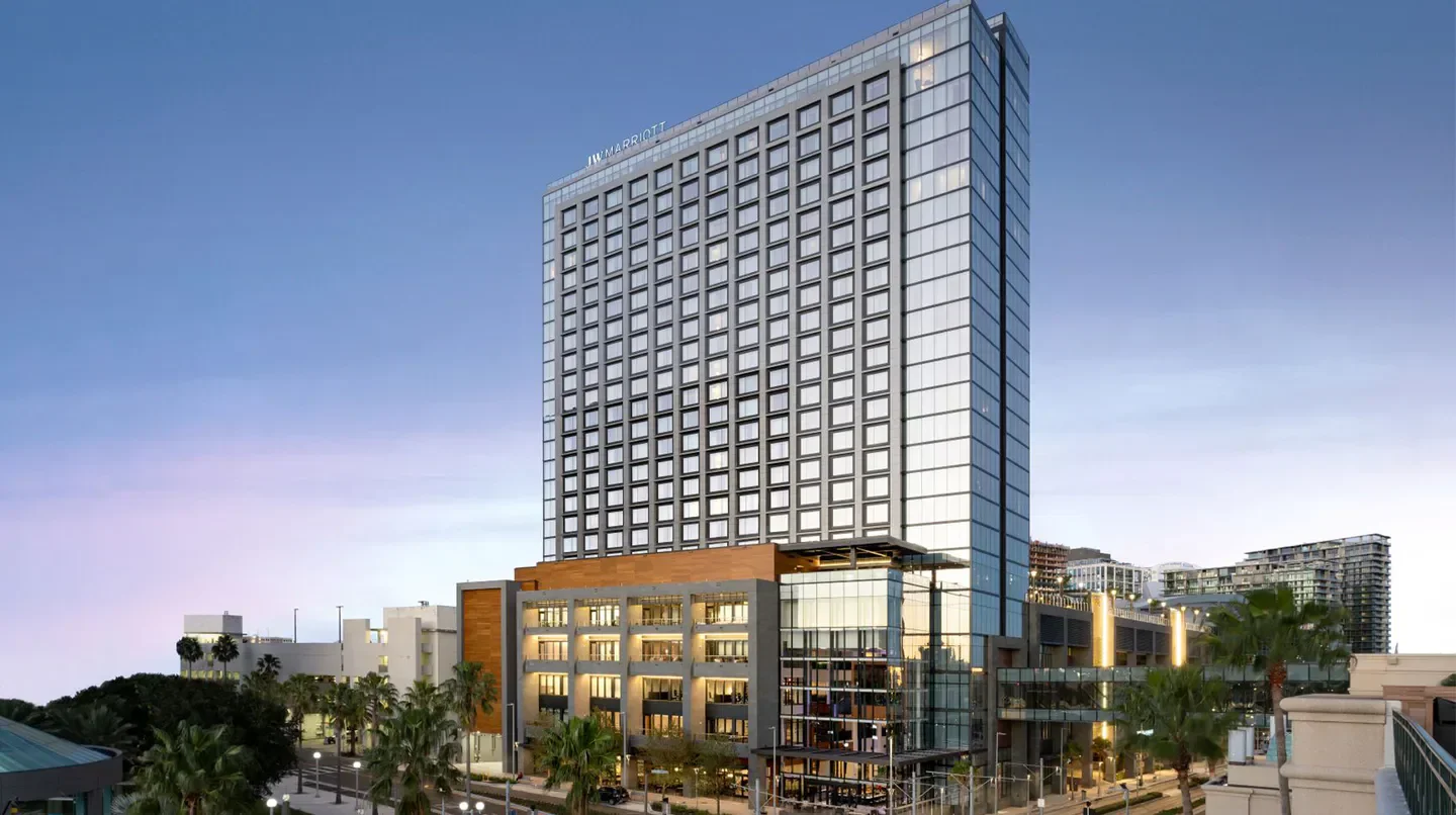 JW Marriott Tampa Water Street hotel exterior in Tampa, Florida at dusk.