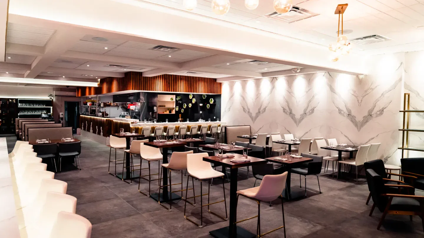 Elegant interior of Kabooki Sushi in Orlando, featuring stylish seating and marble accents.