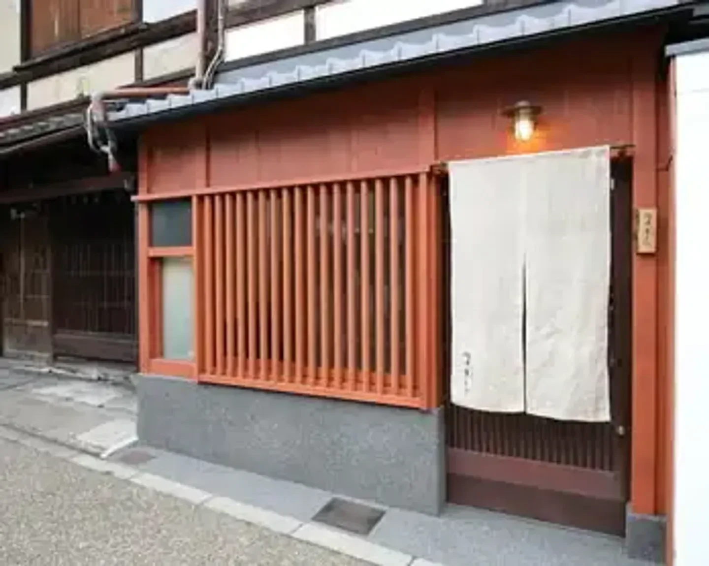 Exterior of Kako Okamoto restaurant in Kyoto, featuring traditional Japanese architecture.
