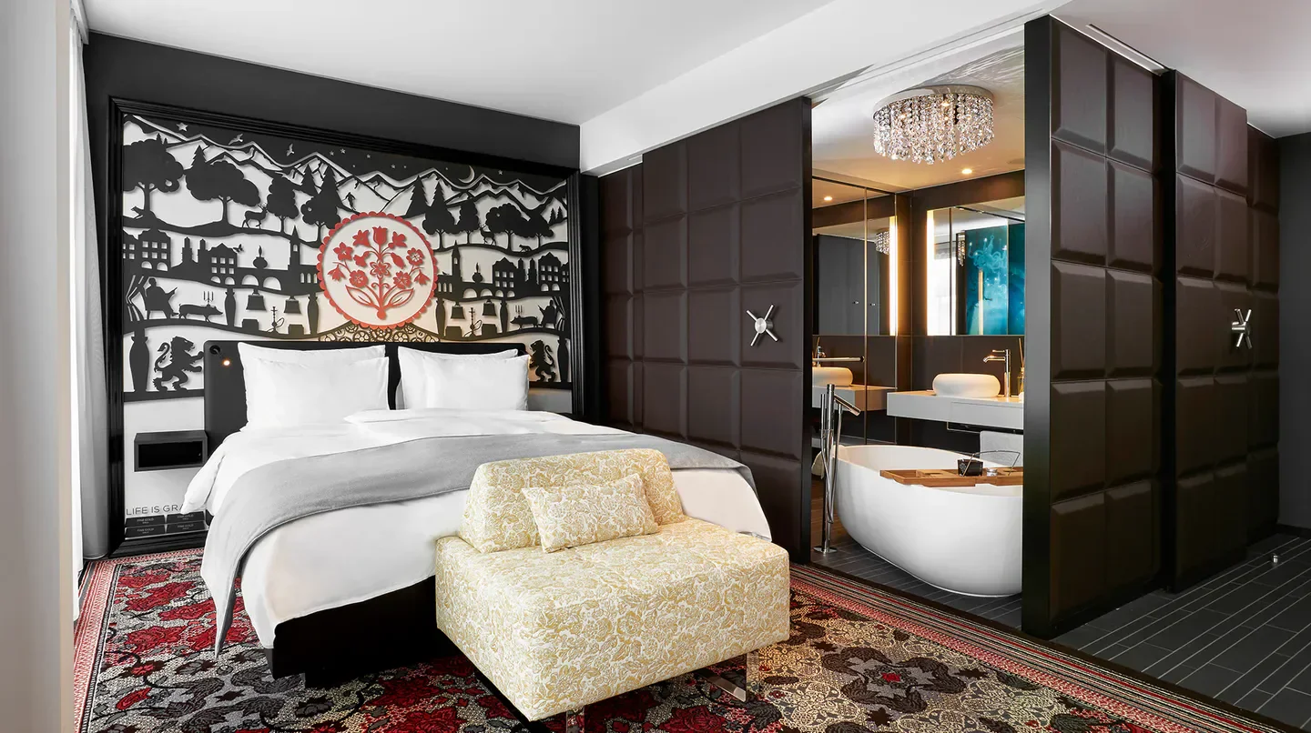 Stylish bedroom at Kameha Grand Zürich hotel in Zurich, featuring a luxurious design.