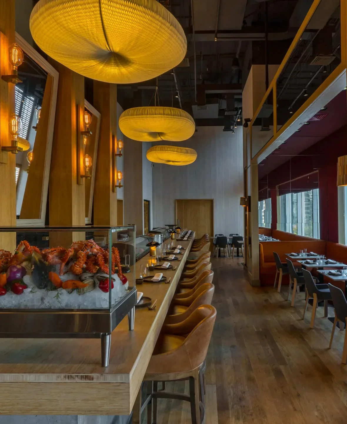 Interior of Karai by Mitsuharu restaurant in Santiago, with crab display and modern design.