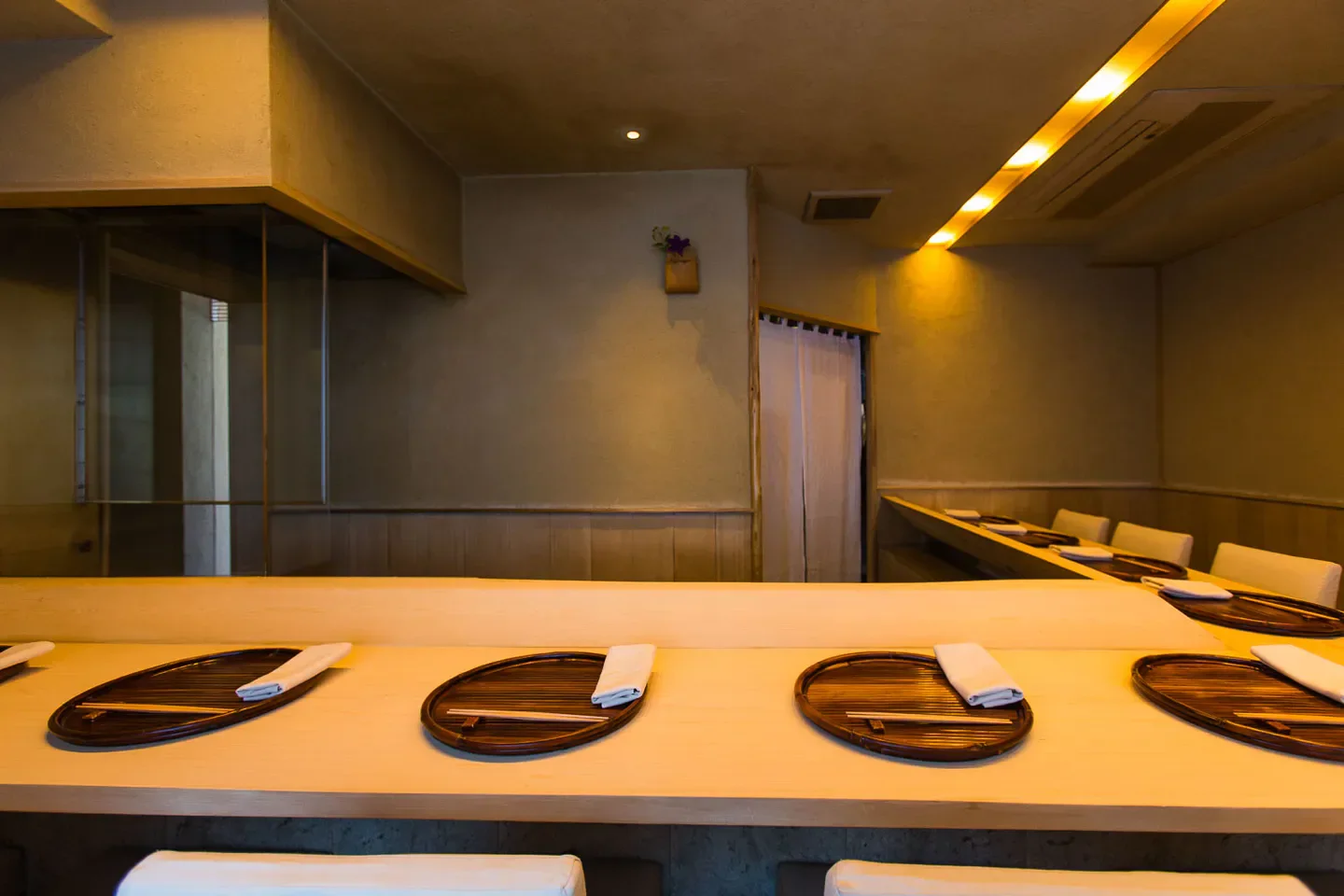 Interior of Kasumicho Yamagami restaurant in Tokyo, showcasing elegant table settings and ambiance.