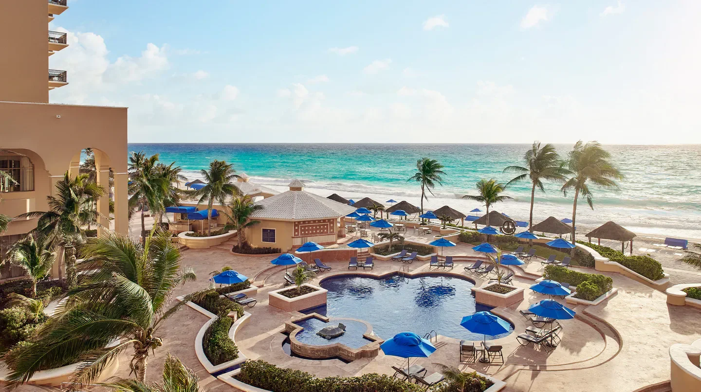 Pool and beach at Kempinski Hotel Cancún, a luxurious resort in Cancun, Mexico.