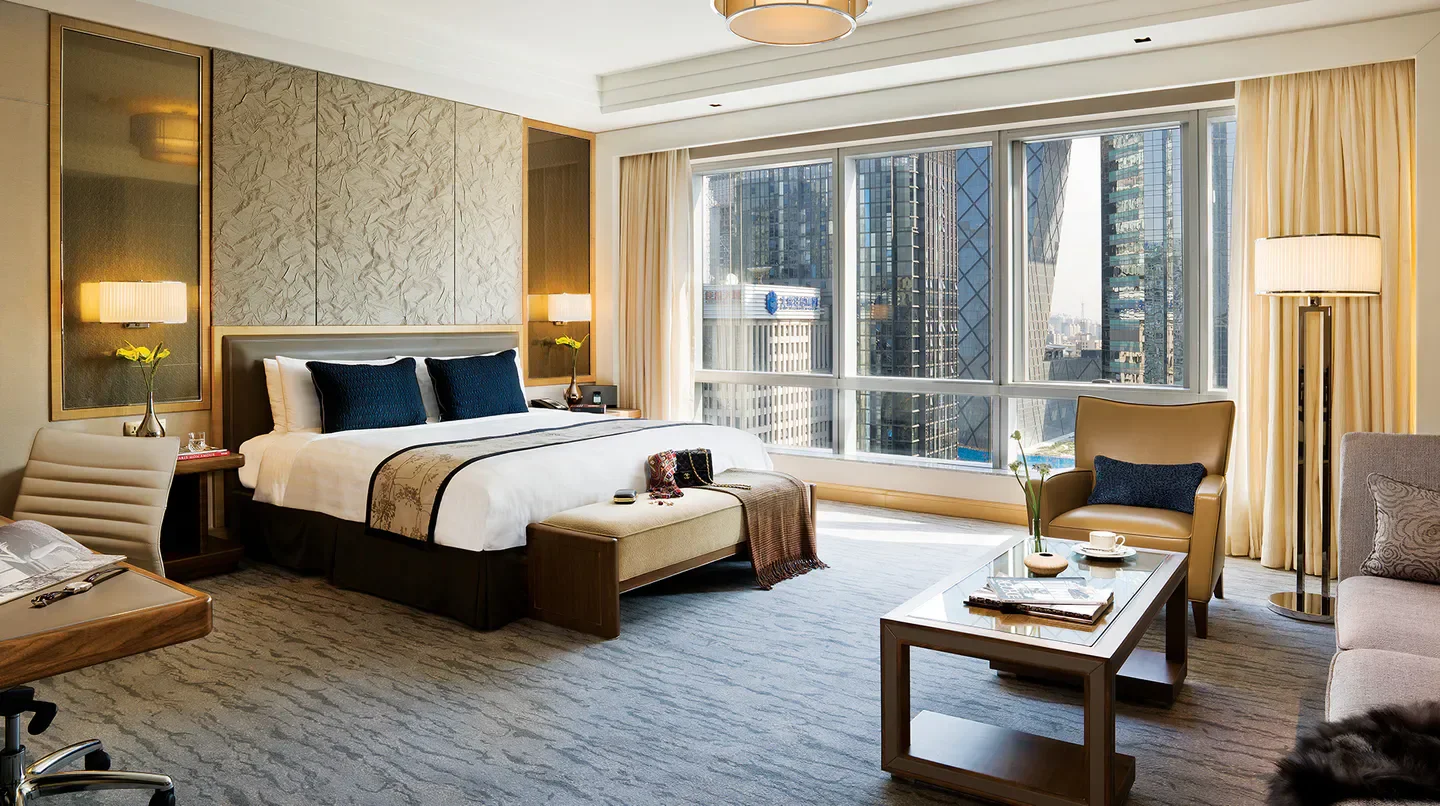 Luxury room at Kerry Hotel, Beijing, with a cityscape view of Beijing.