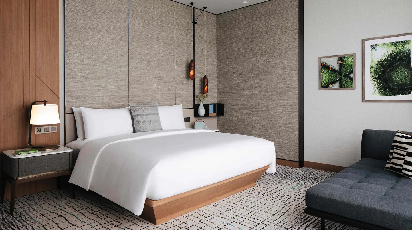 Elegant bedroom at Kimpton Maa-Lai Bangkok. Stylish interior with a minimalist design in Bangkok.