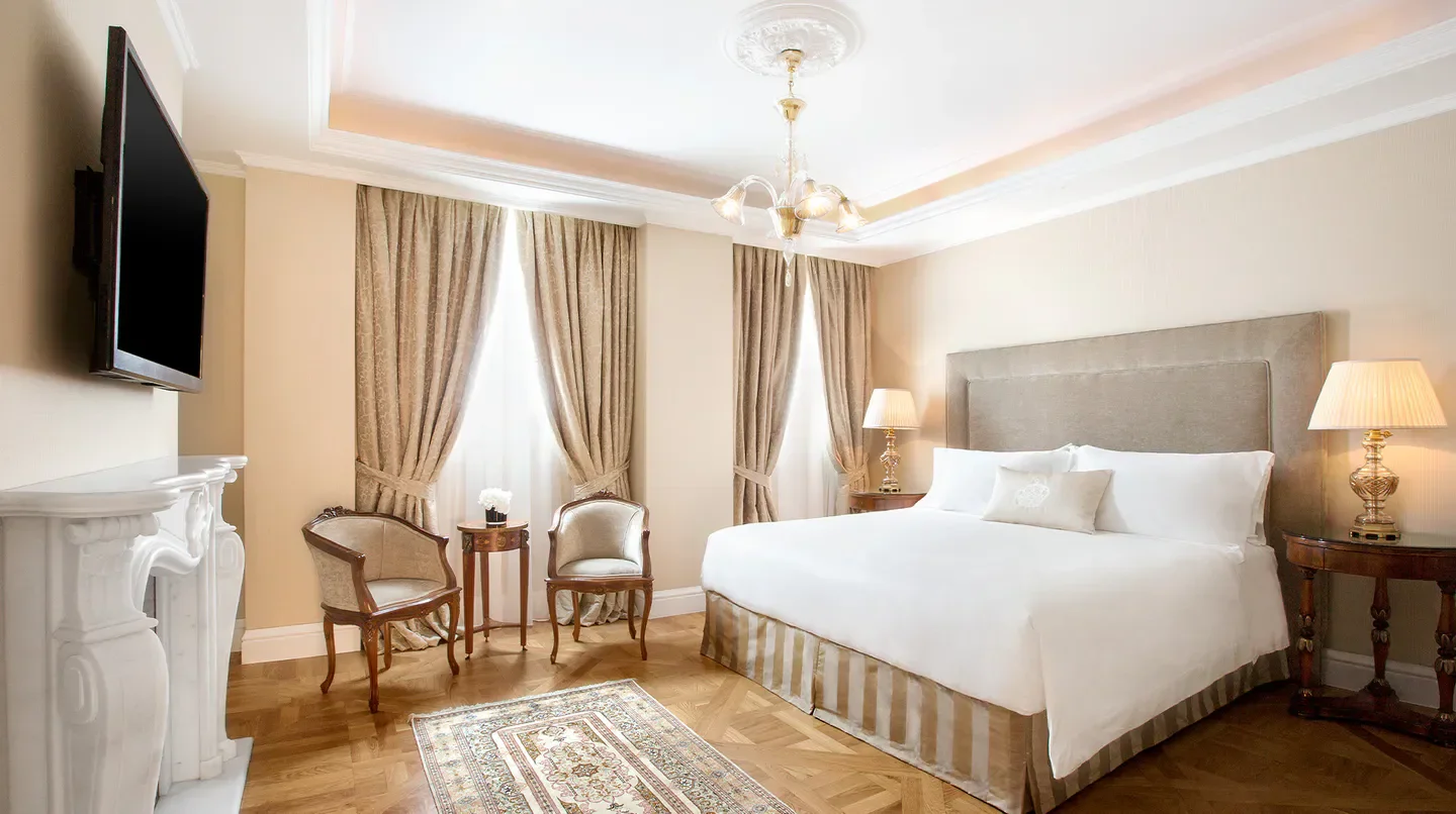 Elegant bedroom at King George, a Luxury Collection Hotel, Athens, with luxurious furnishings.