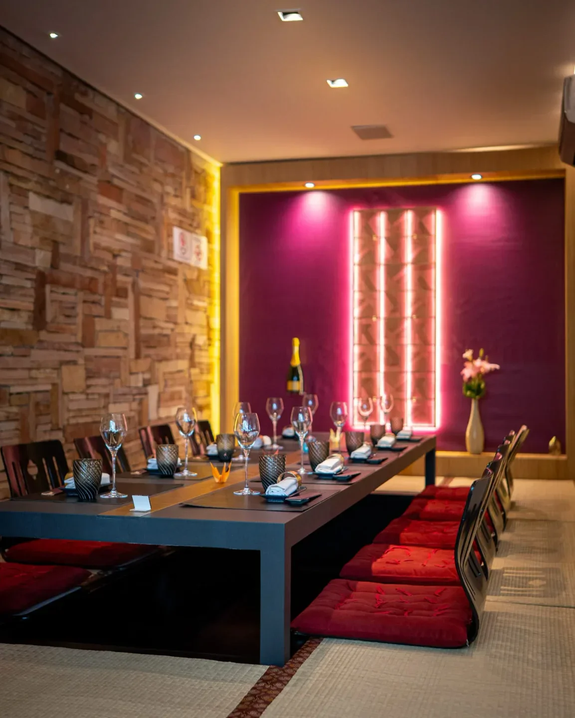 Elegant dining at Kinoshita restaurant in Sao Paulo, with a long table setting.