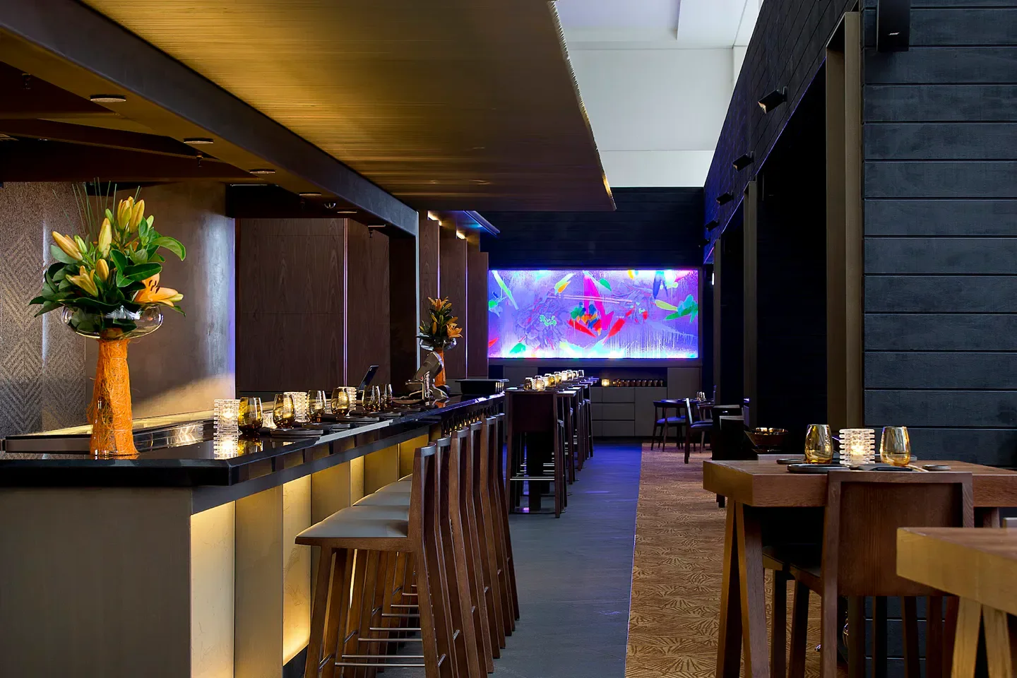 Stylish interior of Kiyomi restaurant in Gold Coast, with bar and artistic background.