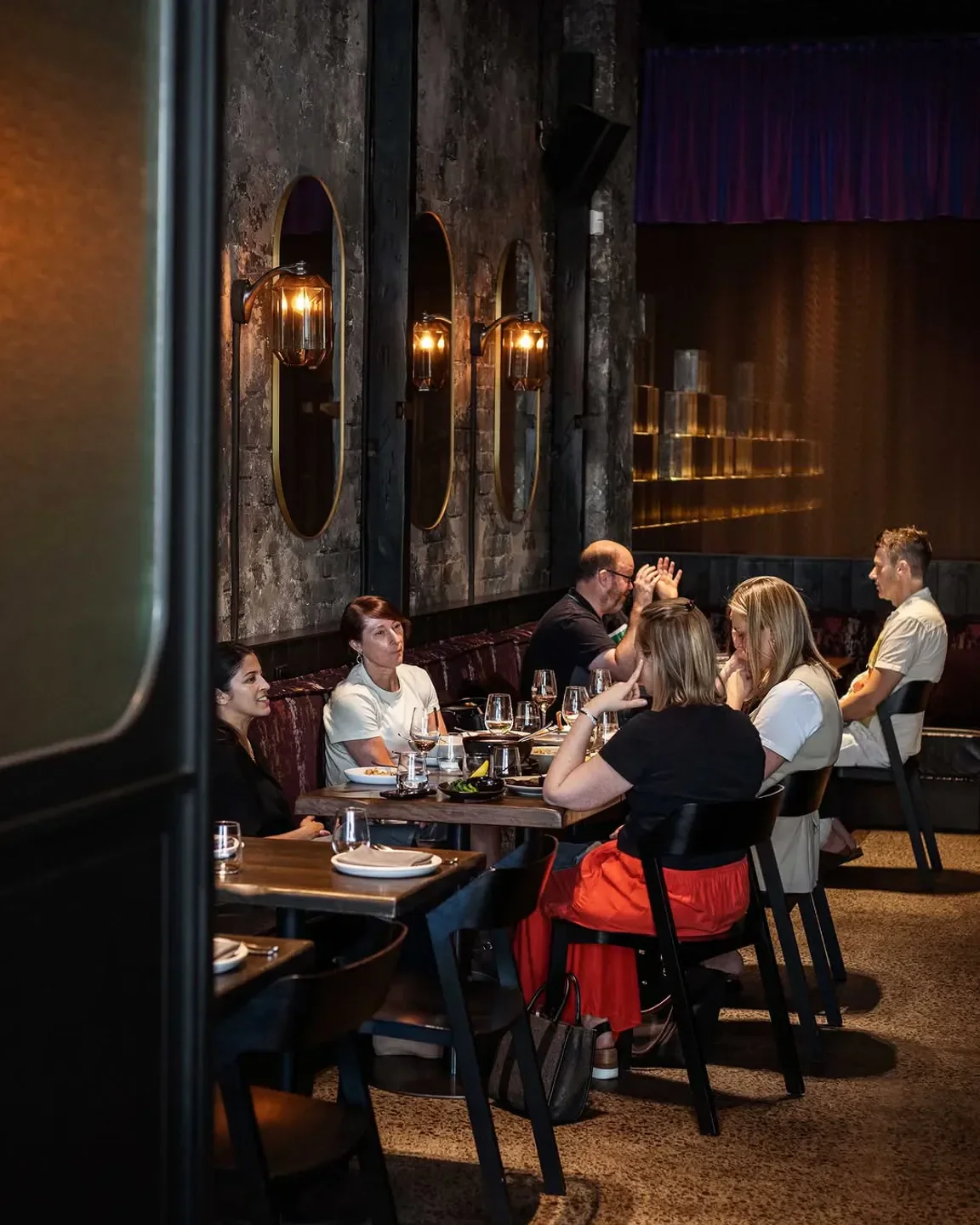 Dining scene at Klae restaurant in Melbourne, featuring stylish interior and seated guests.