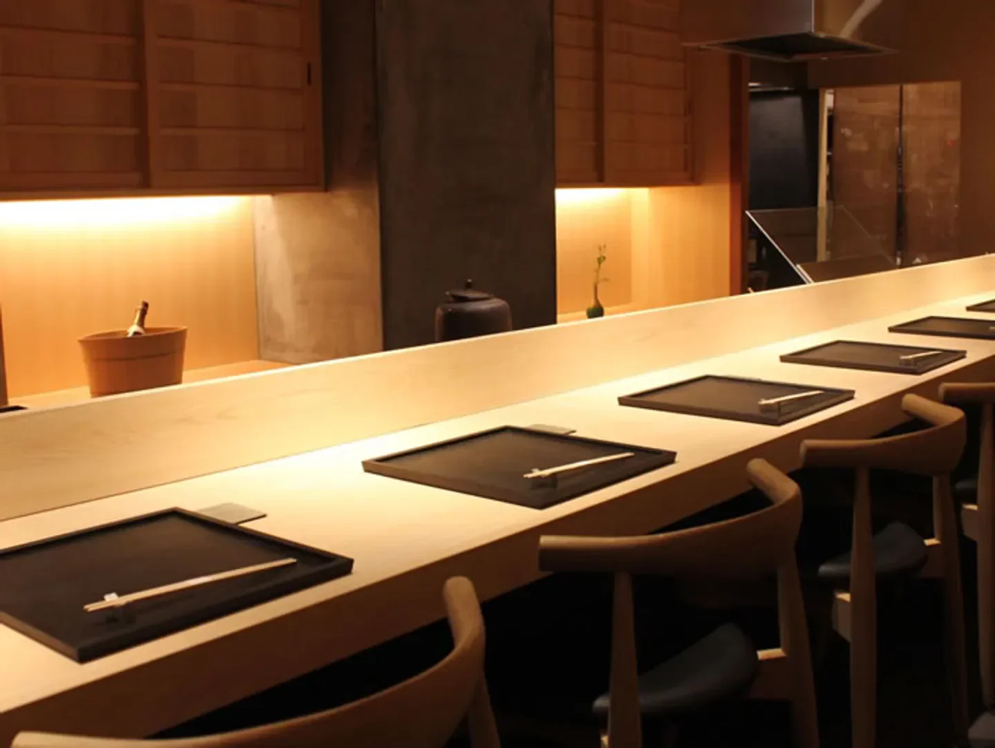 Interior dining at Konoha restaurant in Osaka, showcasing elegant sushi bar seating.