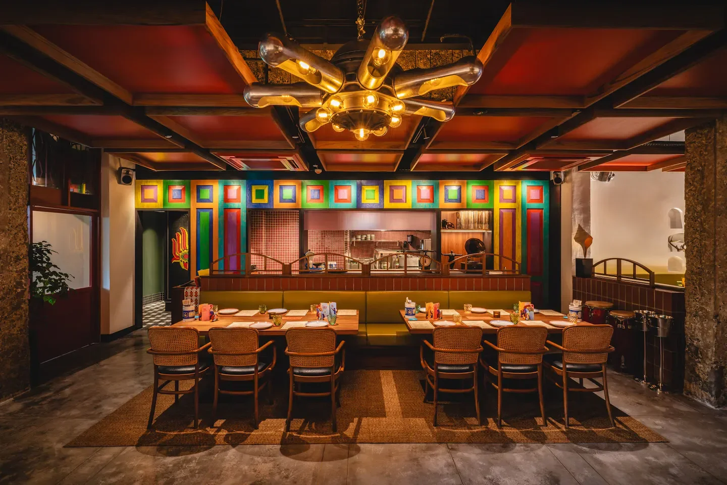 Interior of Kotuwa restaurant in Singapore, featuring colorful decor and stylish seating.