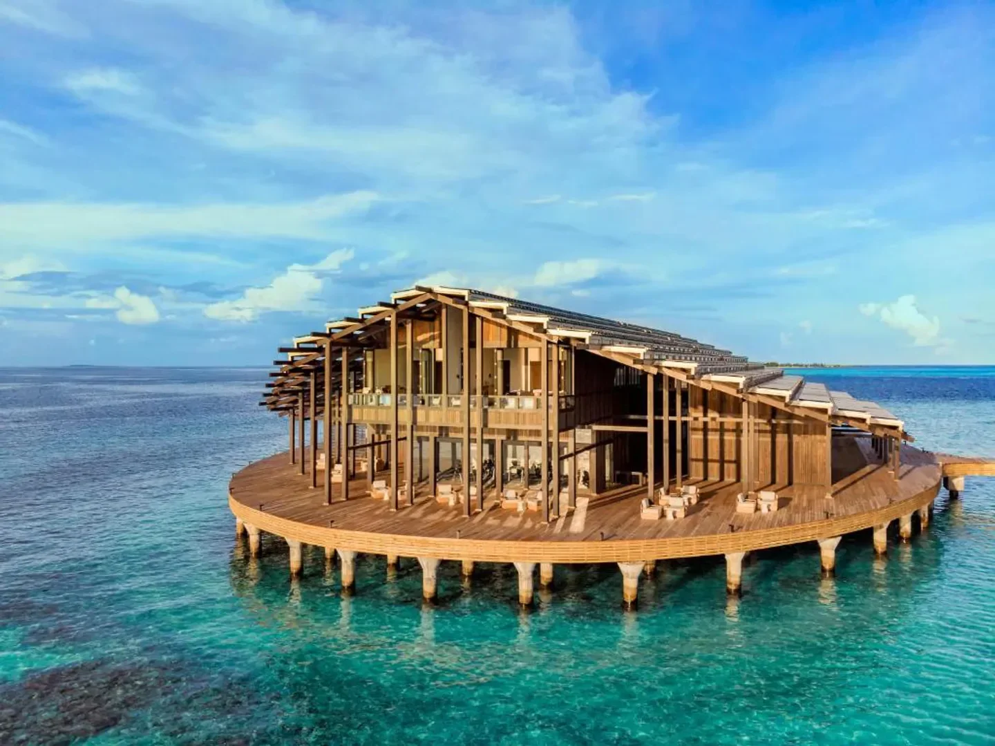 Stunning Kudadoo Maldives Private Island resort over the turquoise waters of the Maldives